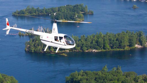 A helicopter flying above the St. Lawrence River.