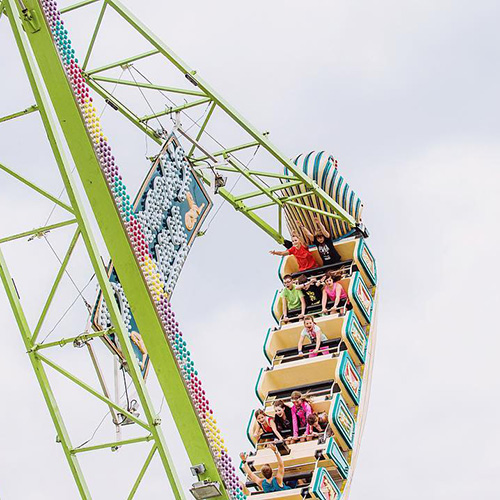 People at a fair on a ride.