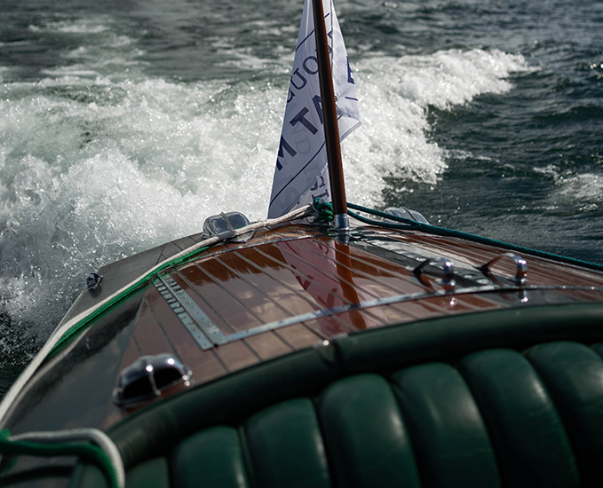 A historic wooden boat in the St. Lawrence River.