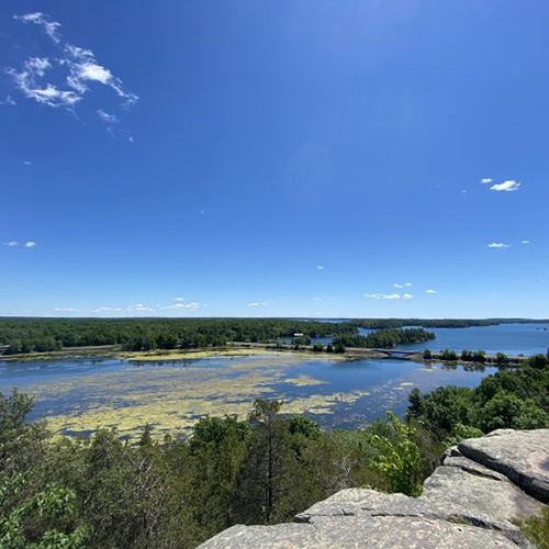 A view of the St. Lawrence River with a blue sky above.