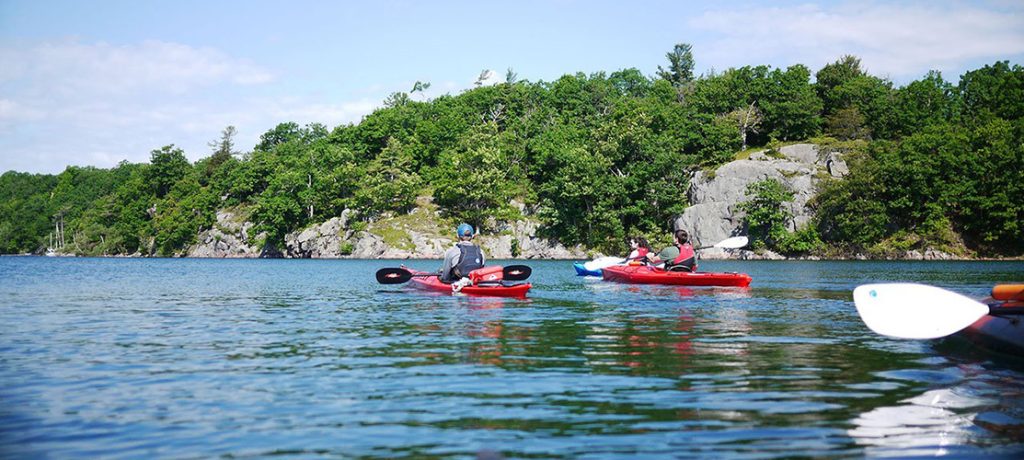 A group of kayakers in the 1000 Islands.