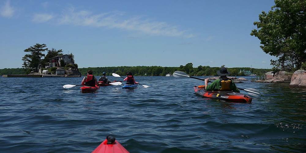 A group of kayakers in the 1000 Islands.