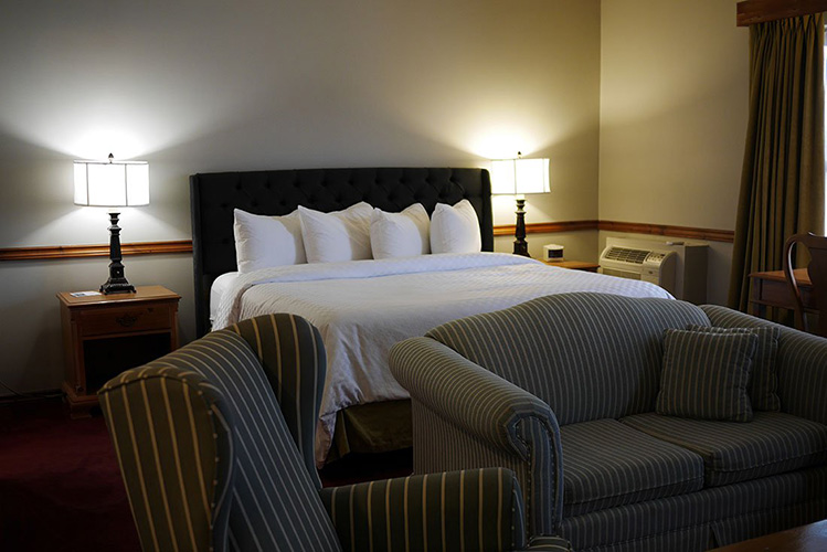 A bed inside a hotel room.