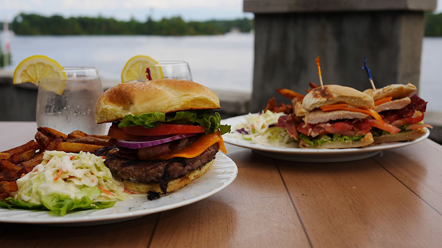 A hamburger with a side of fries.