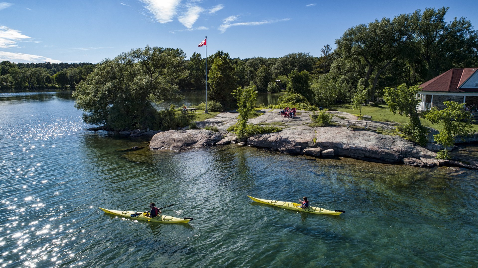 Two kayakers paddle through the St. Lawrence River.