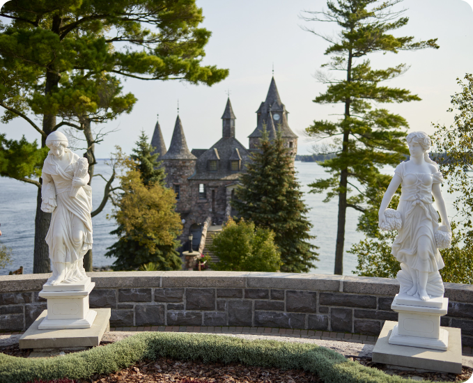 Two statues in front of Boldt Castle.