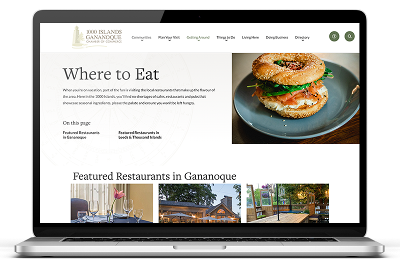 An open laptop showcasing a website that says, "Where to Eat"